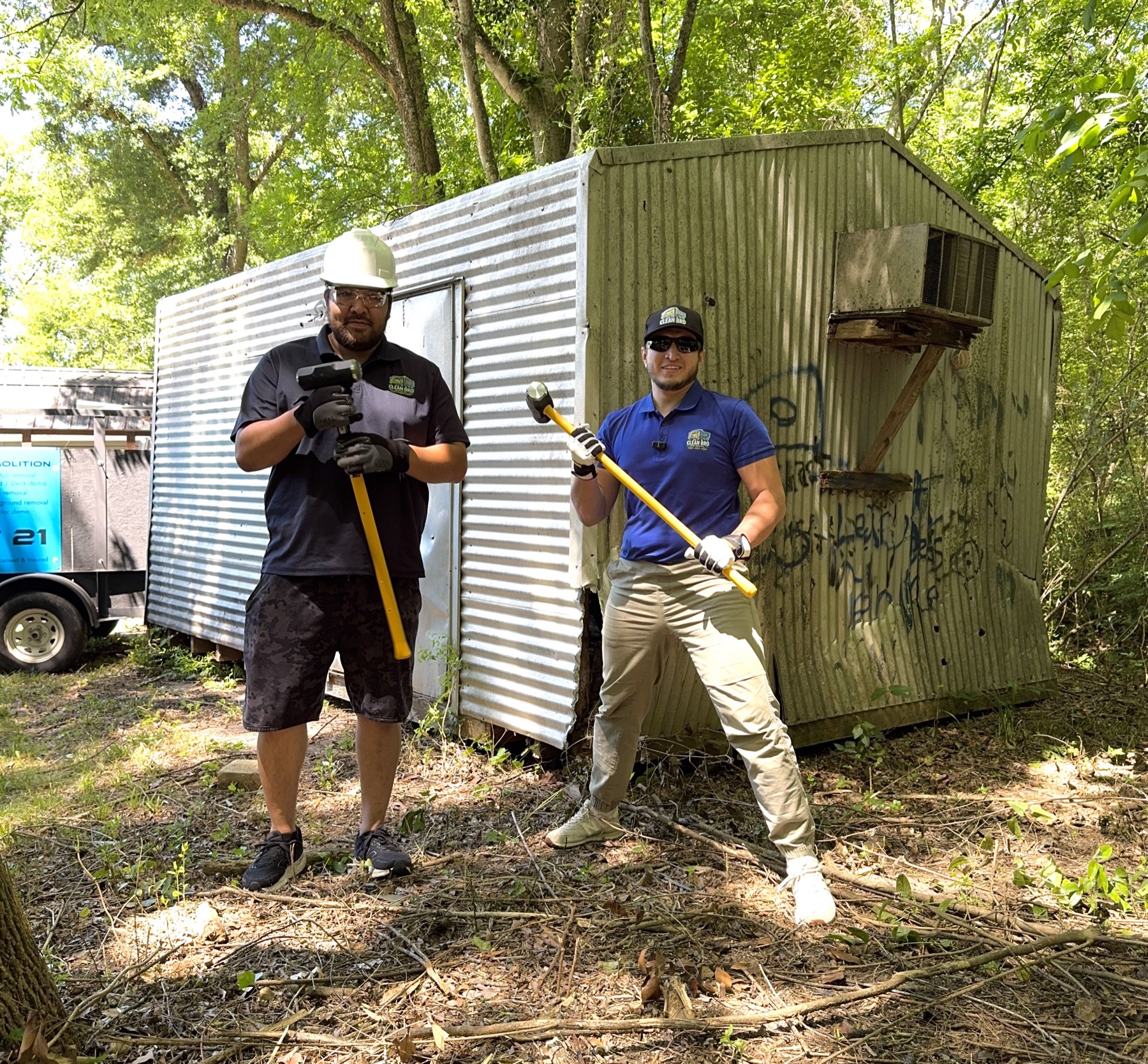 CleanBroServices crew preparing a shed demolition job with tools on site.